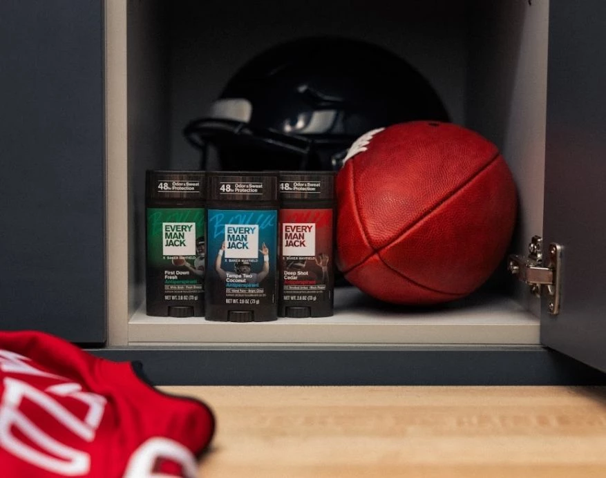 Every Man Jack x Baker Mayfield collection in a football locker with a ball and jersey.