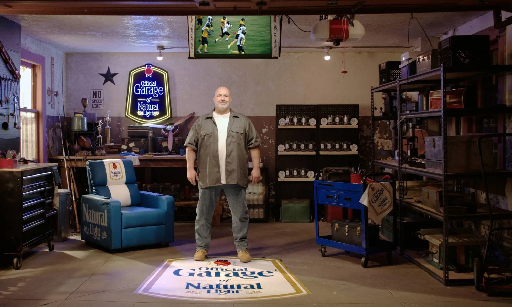 Interior of a garage with Natural Light branded furniture and signs.