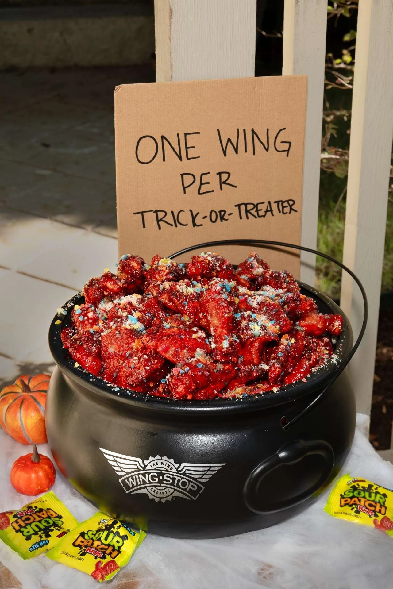 Wingstop x SOUR PATCH KIDS Wicked Punch wings in a trick-or-treat bowl.