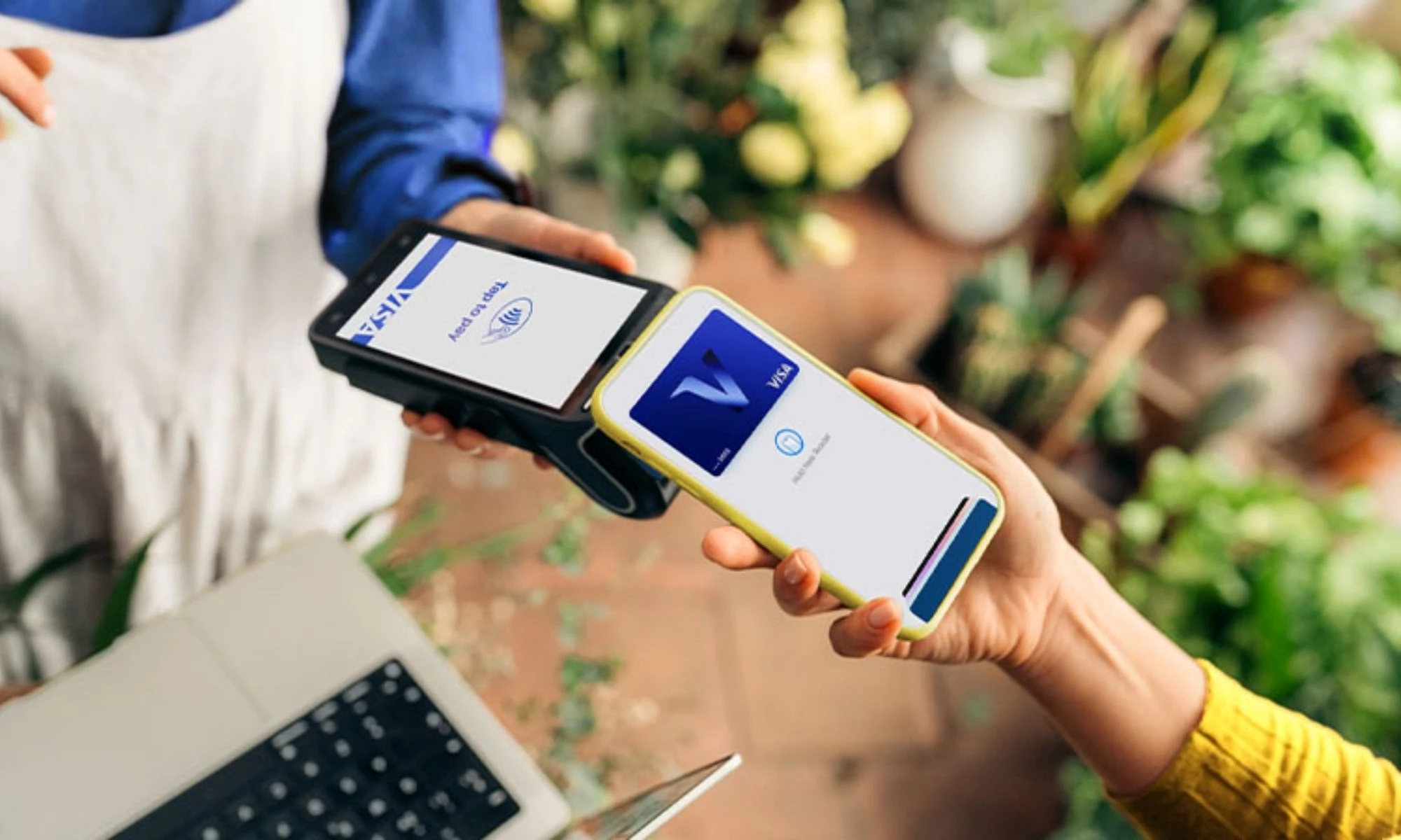 visa-rebrand-new-v-tap-payment Visa phone tap payment at a point of sale.