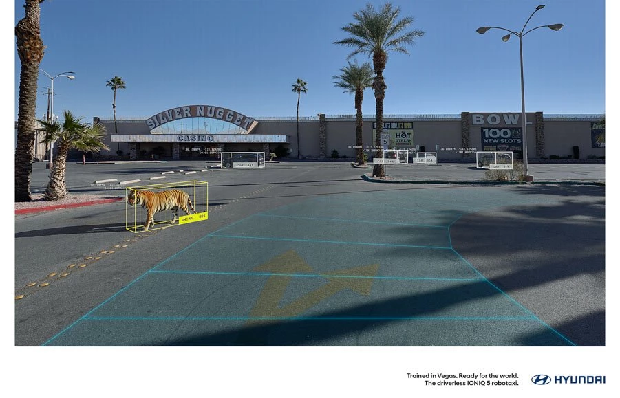 A tiger is seen walking in an empty parking lot for Hyundai's new print ad.