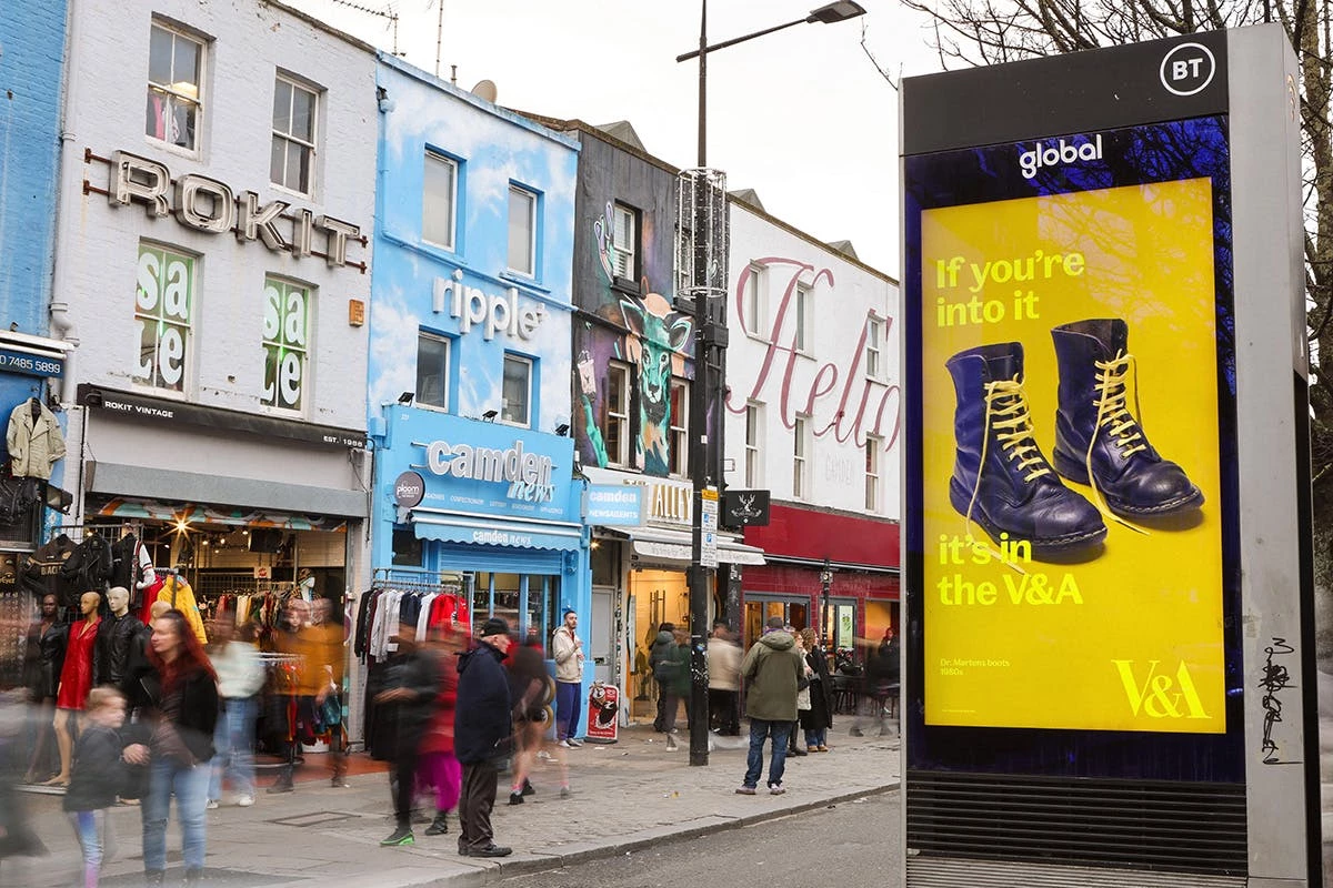 The ‘If You’re Into It, It’s in the V&A’ campaign's print ad features Dr. Martens located at a shopping district.