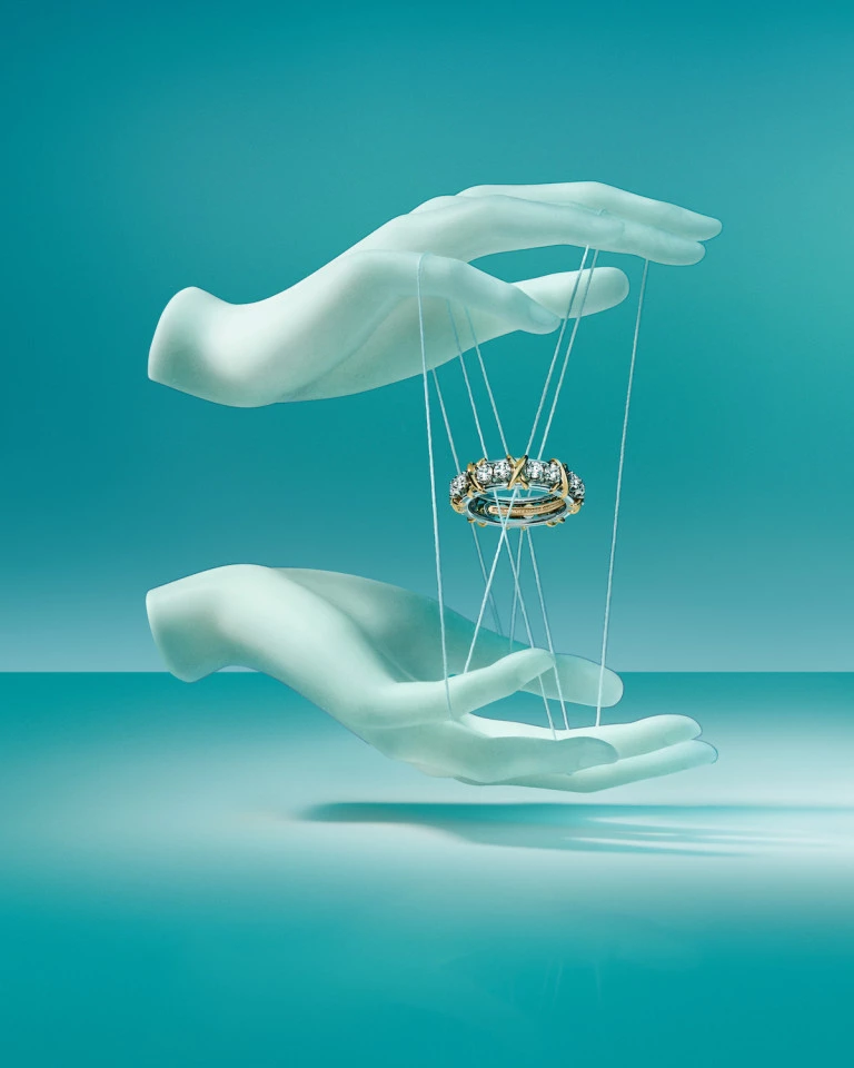 'With Love Since 1837' Campaign Image, Diamond Ring h Promo image from the 'With Love, Since 1837' campaign, featuring mannequin hands and diamond ring in the center