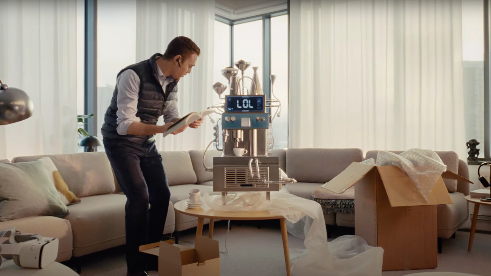 Still taken from the Philips 'join the new coffee movement' campaign of man struggling with complicated coffee machine