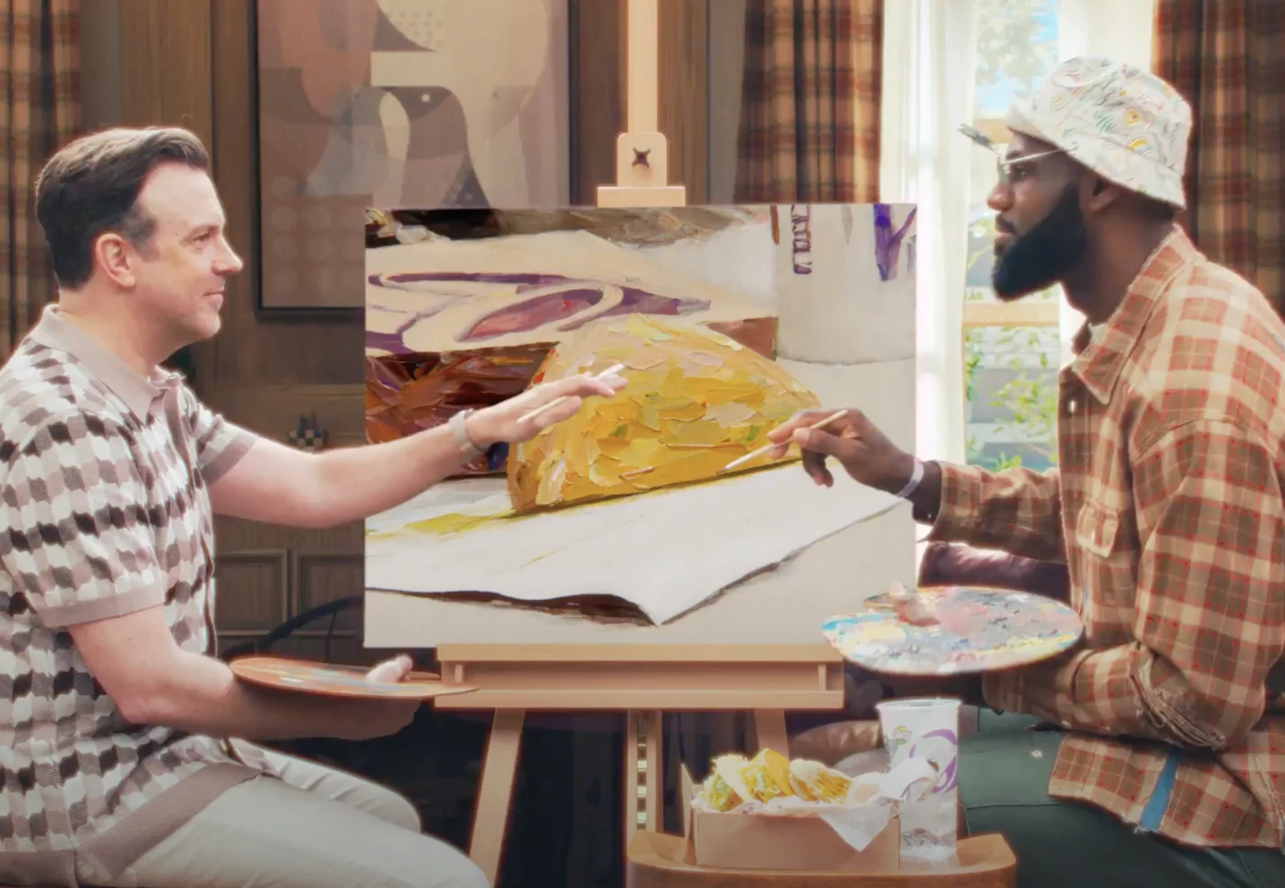 James and Sudeikis Painting the Taco Bell Cantina Chicken Crispy Taco | Source: PR Newswire