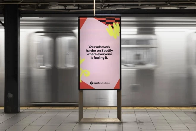 A billboard reads,"Your ads work harded on Spotify where everyone is feeling it."