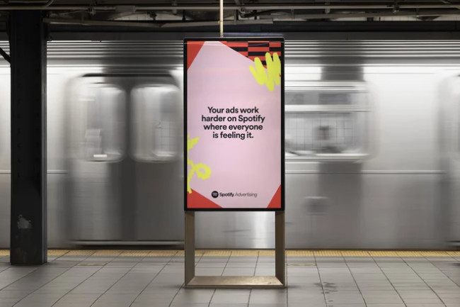 A Billboard Stating 'The Spotify Effect' A billboard reads,"Your ads work harded on Spotify where everyone is feeling it."