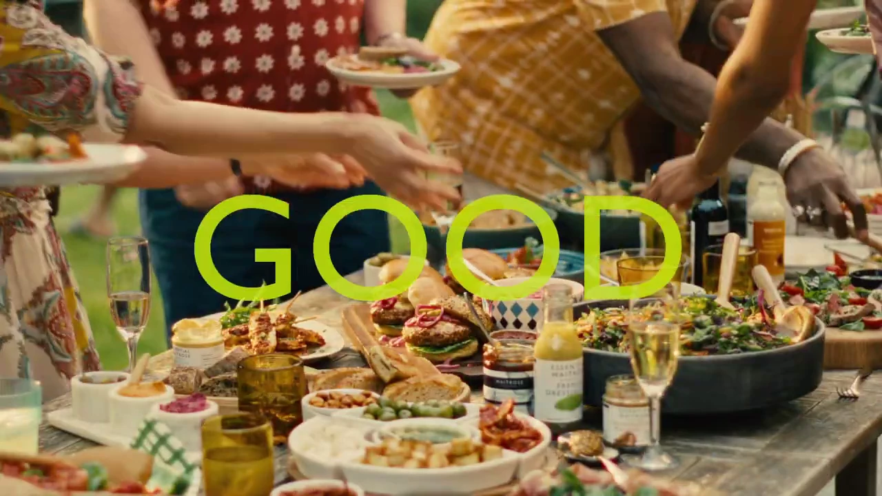 Friends gather around a spread of food