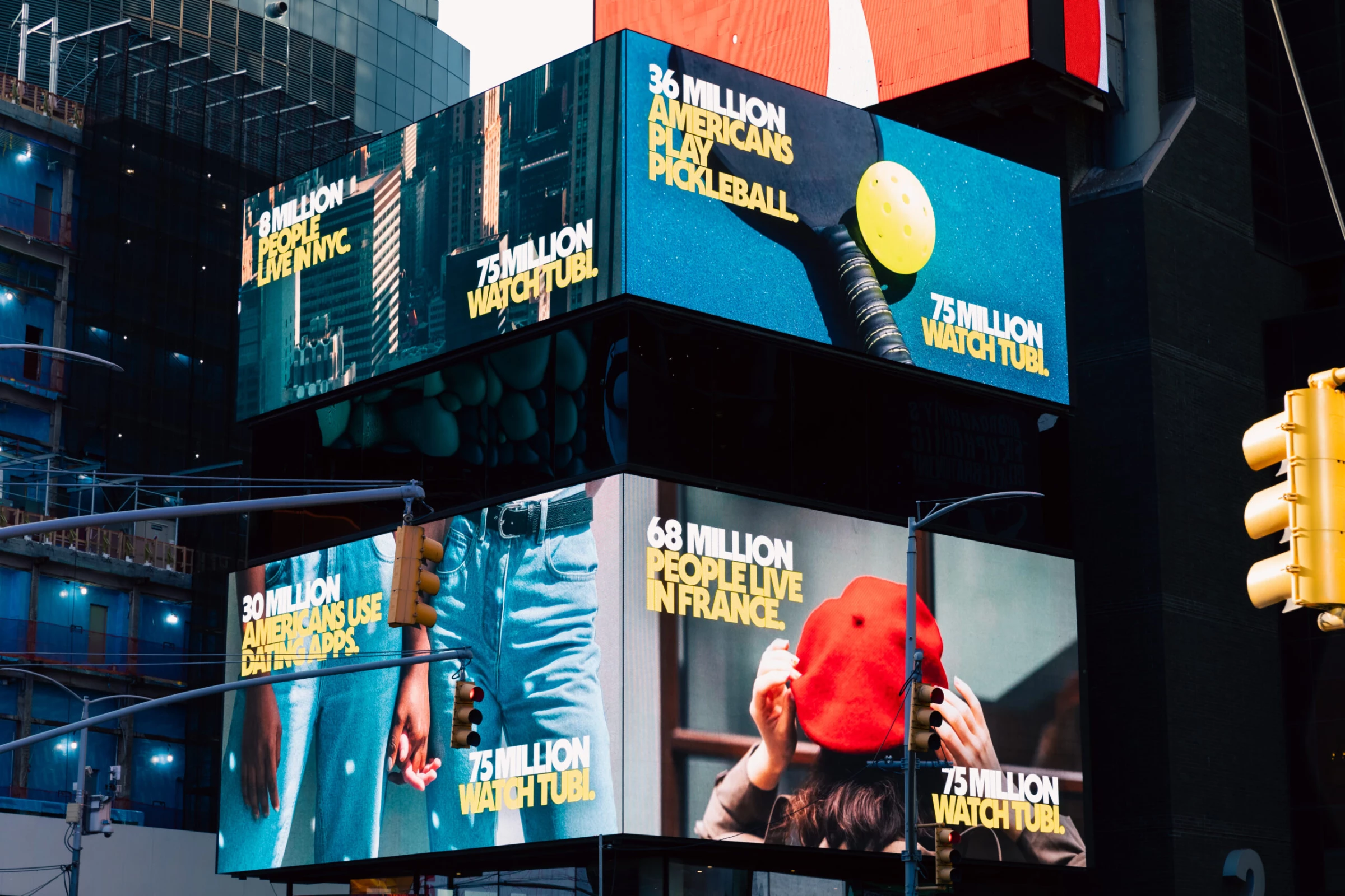 'Tubi Is More Popular Than' campaign is seen here on digital billboards in New York City. 