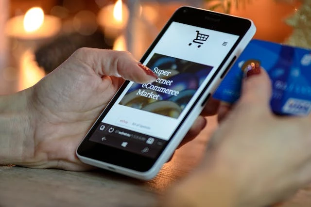 person-using-smartphone-while-shopping Person using smartphone while shopping