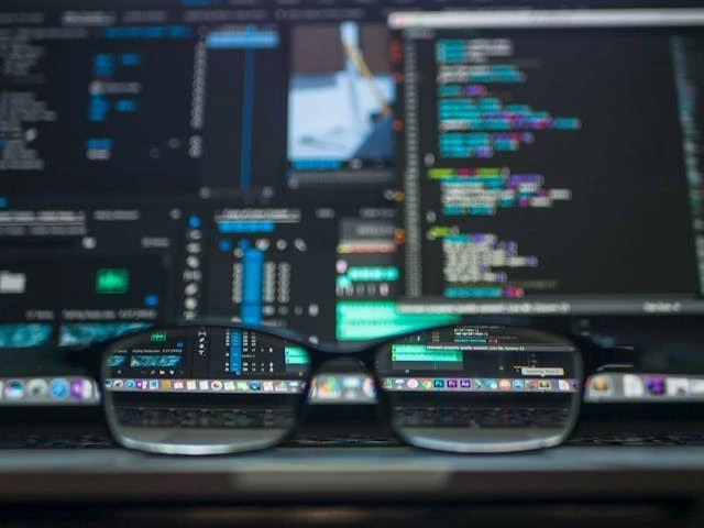 Eyeglasses with code as background