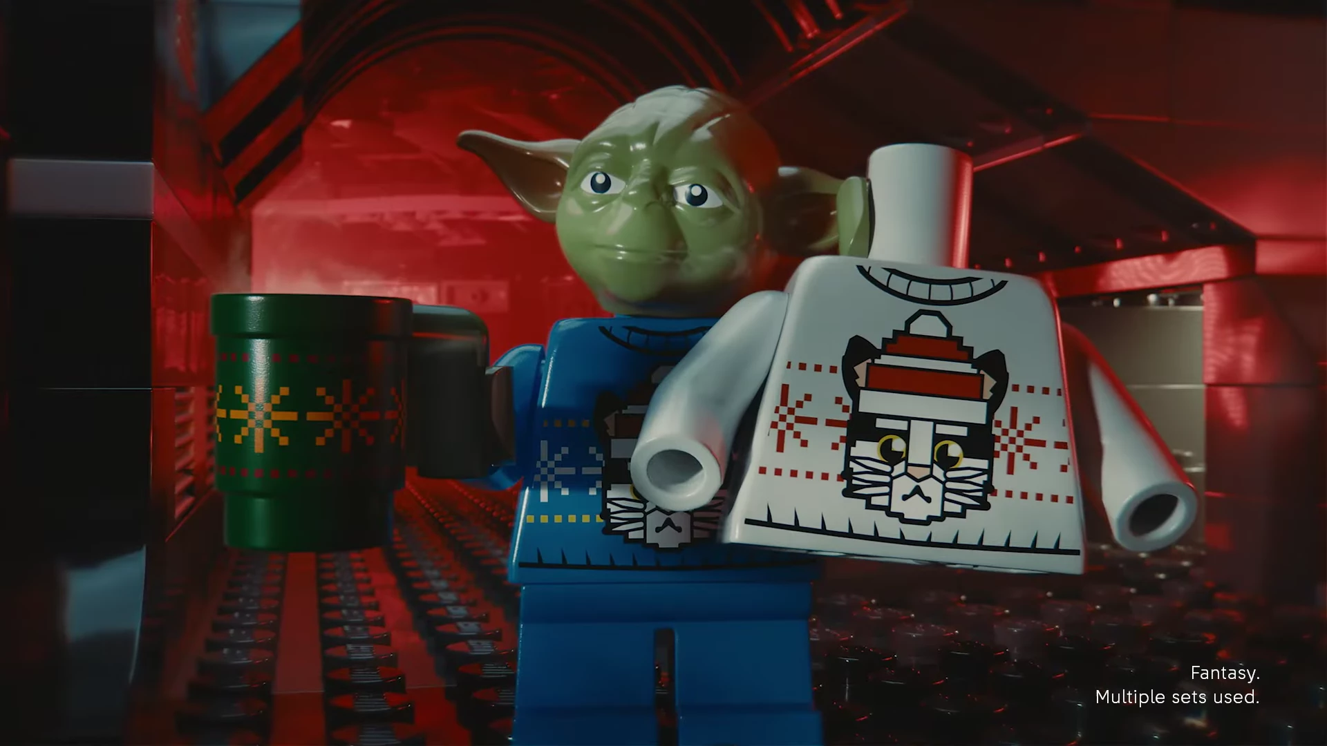 LEGO Yoda holds the Cataclaws Christmas sweater