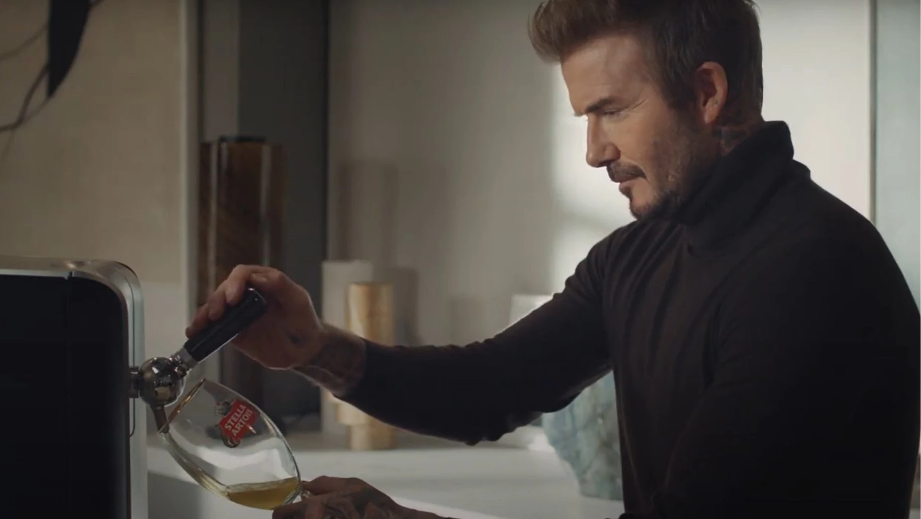 Beckham Pouring Draught Beer Into a Glass Using PerfectDraft | Source: PerfectDraft
