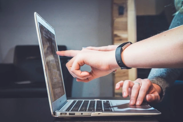 people-pointing-at-laptop-display People pointing at laptop display