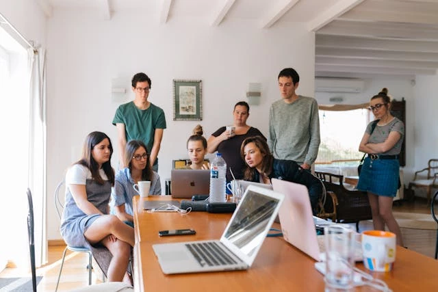 group-gathered-around-laptop Group gathered around laptop