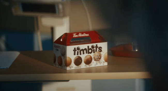 A box of Tim Hortons Timbits acts as motivation to the patient.