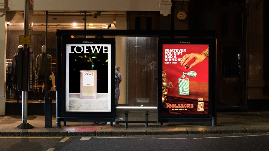 A Toblerone ad beside a fragrance ad