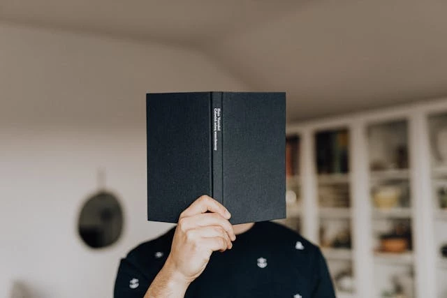 Man with book in hand