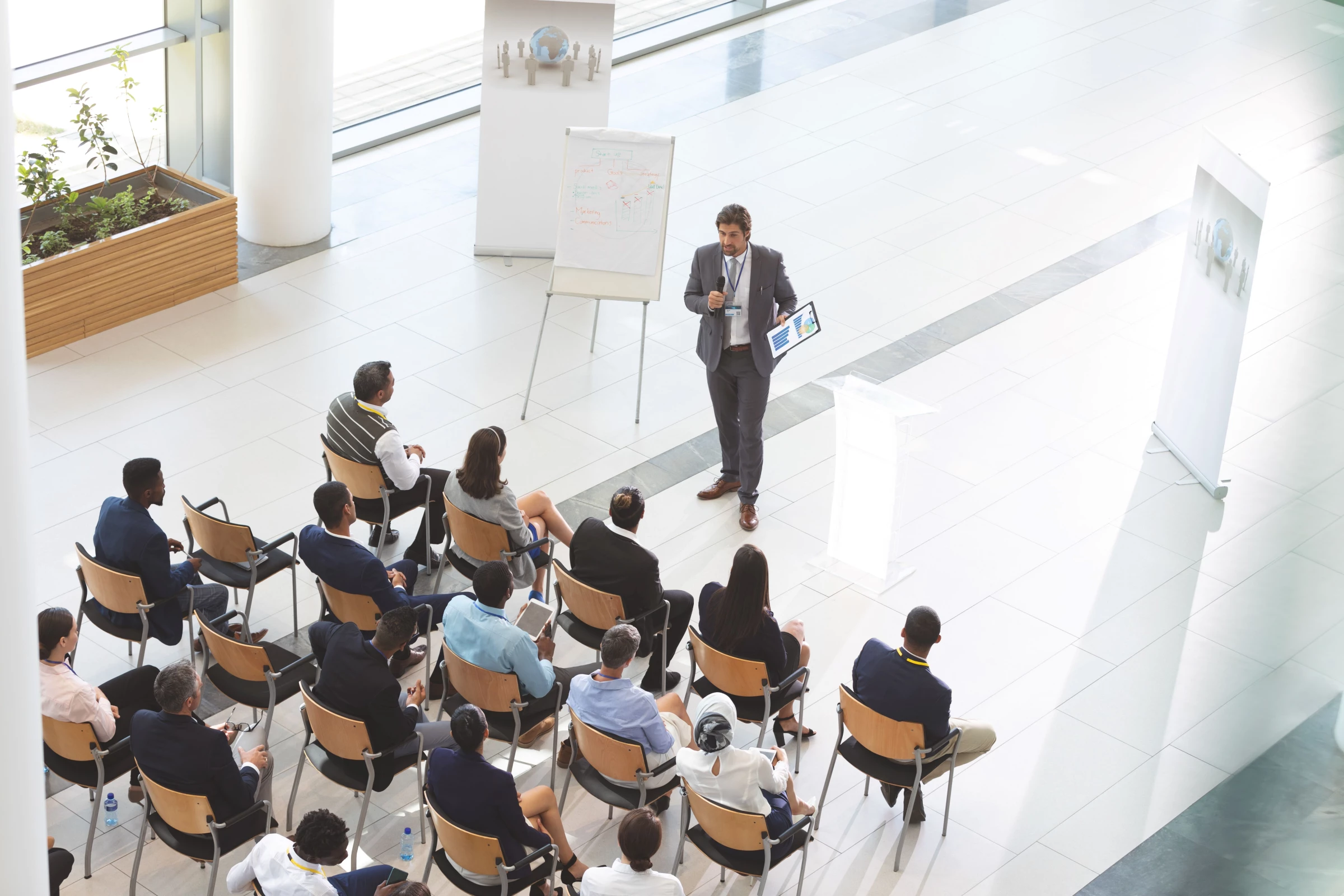 A main trains a group of people on cybersecurity practices