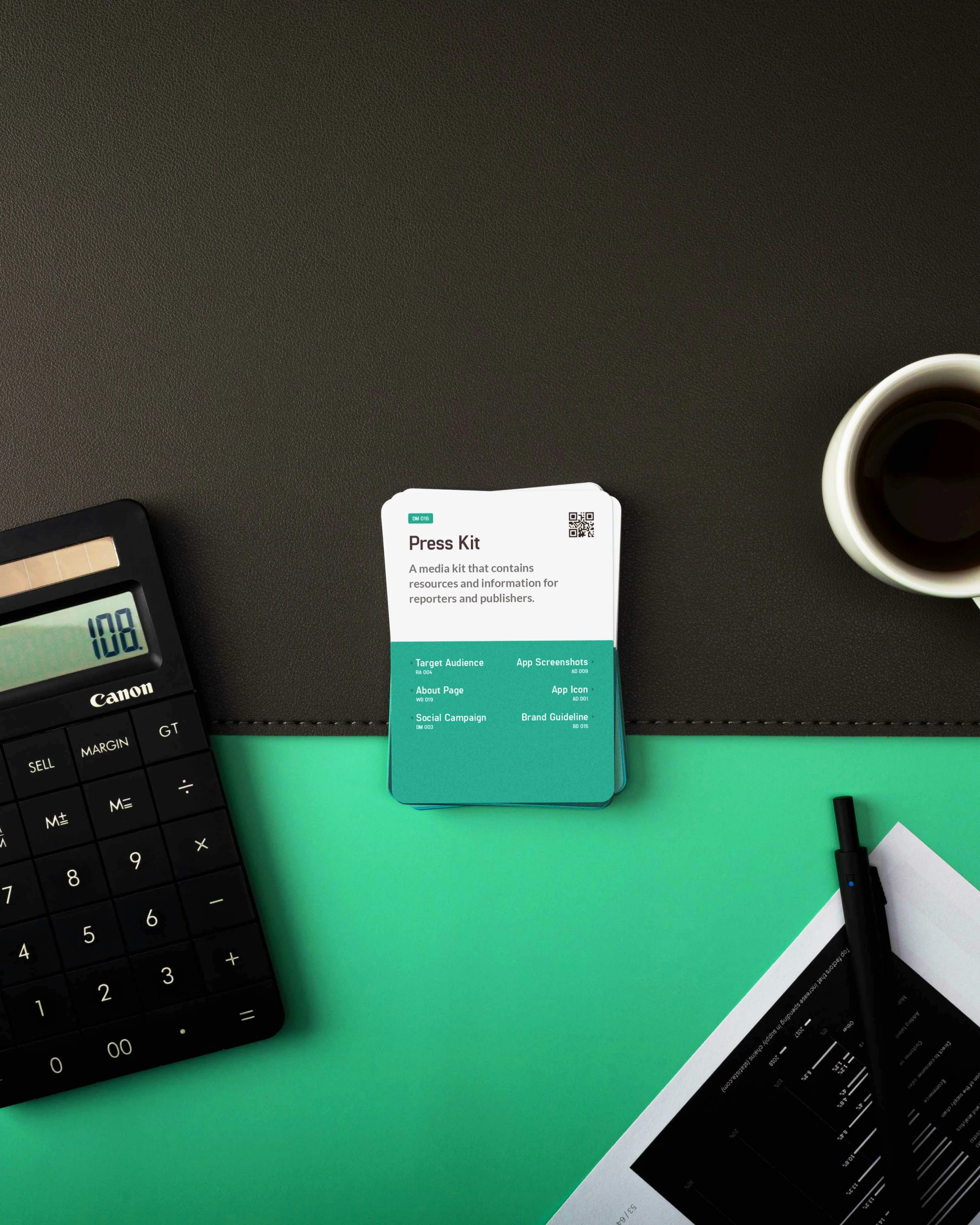 A press kit card displayed on a desk