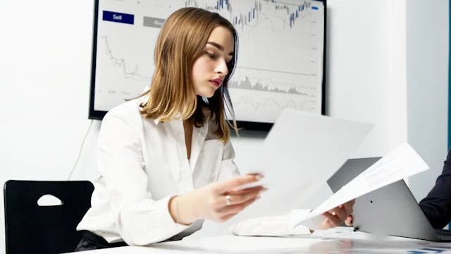 Woman holding papers