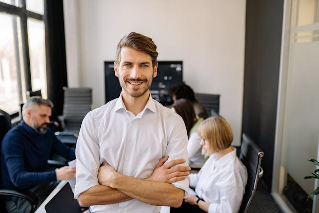 Man in white smiling