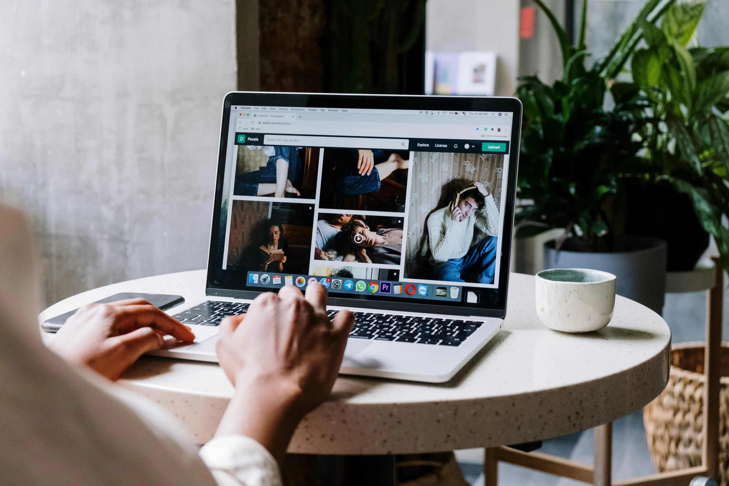 Person on laptop typing on a search bar