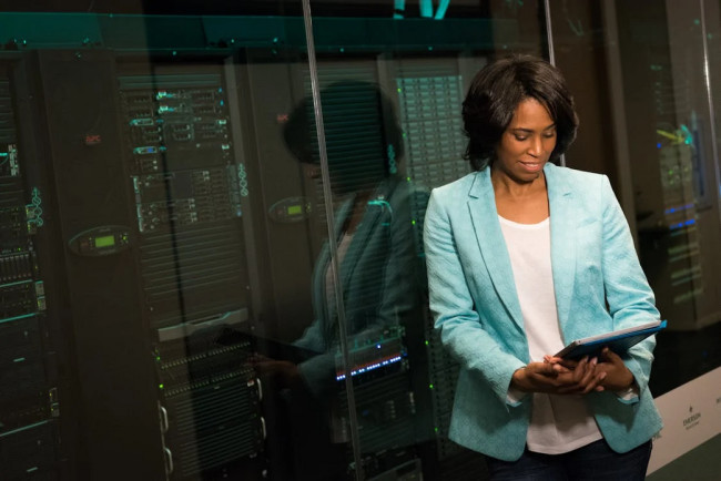 Woman next to servers with tablet