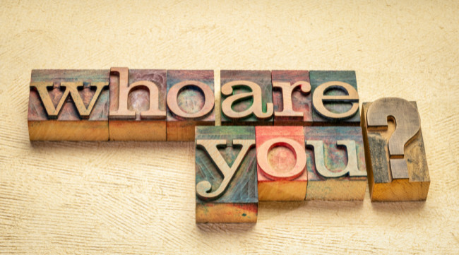 The question “Who are you?” in letterpress wood blocks