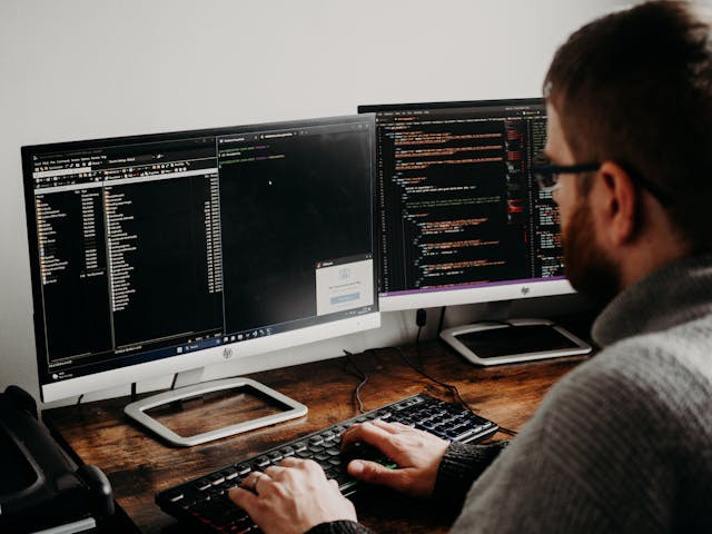 Man coding in his computer