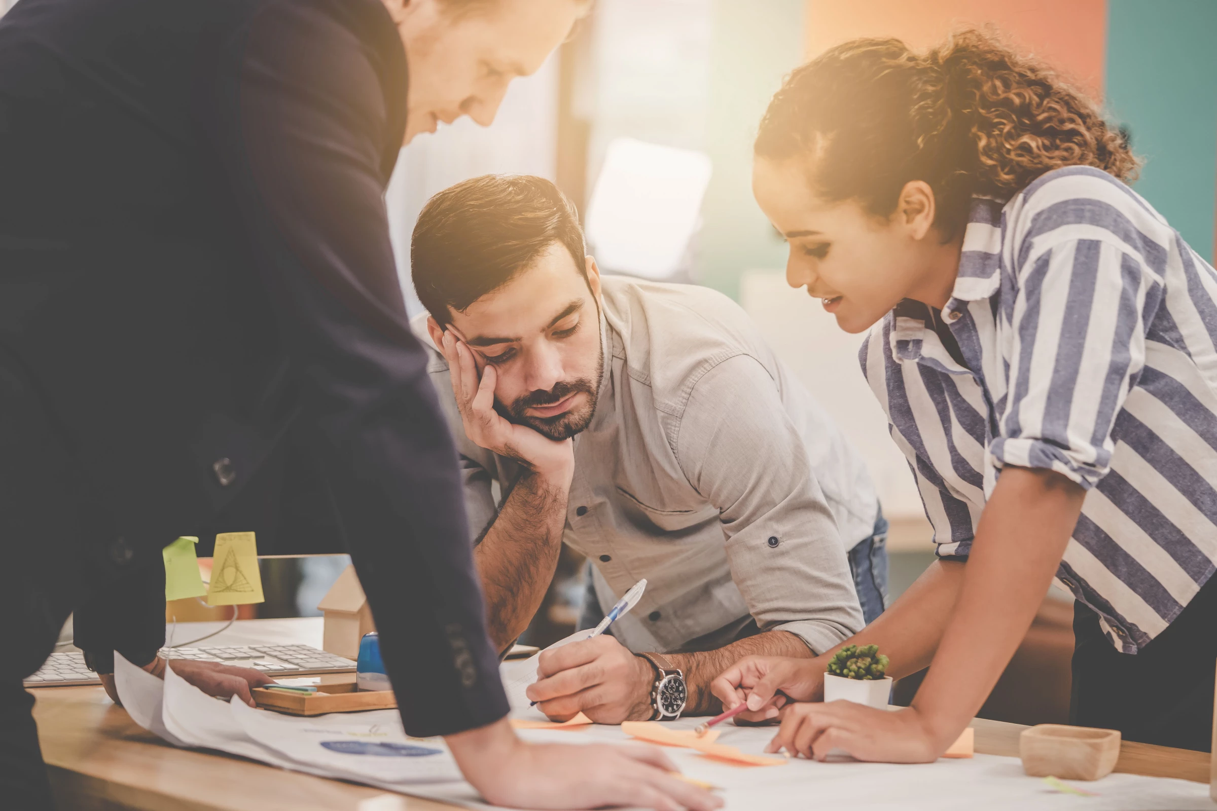 Three engineers brainstorming for ideas
