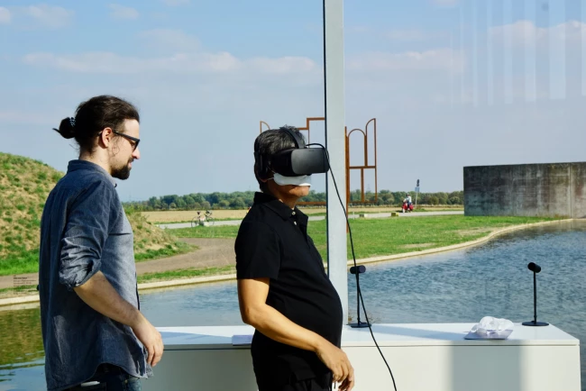 A man takes a virtual property tour with his assistant