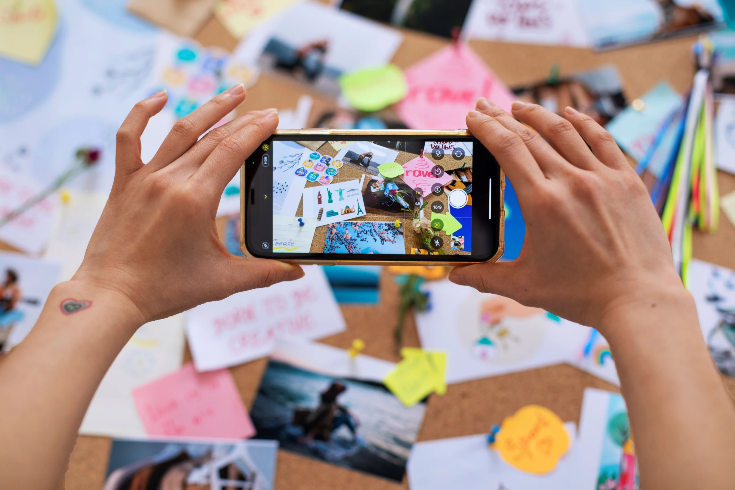 A woman takes photos for social media using her phone