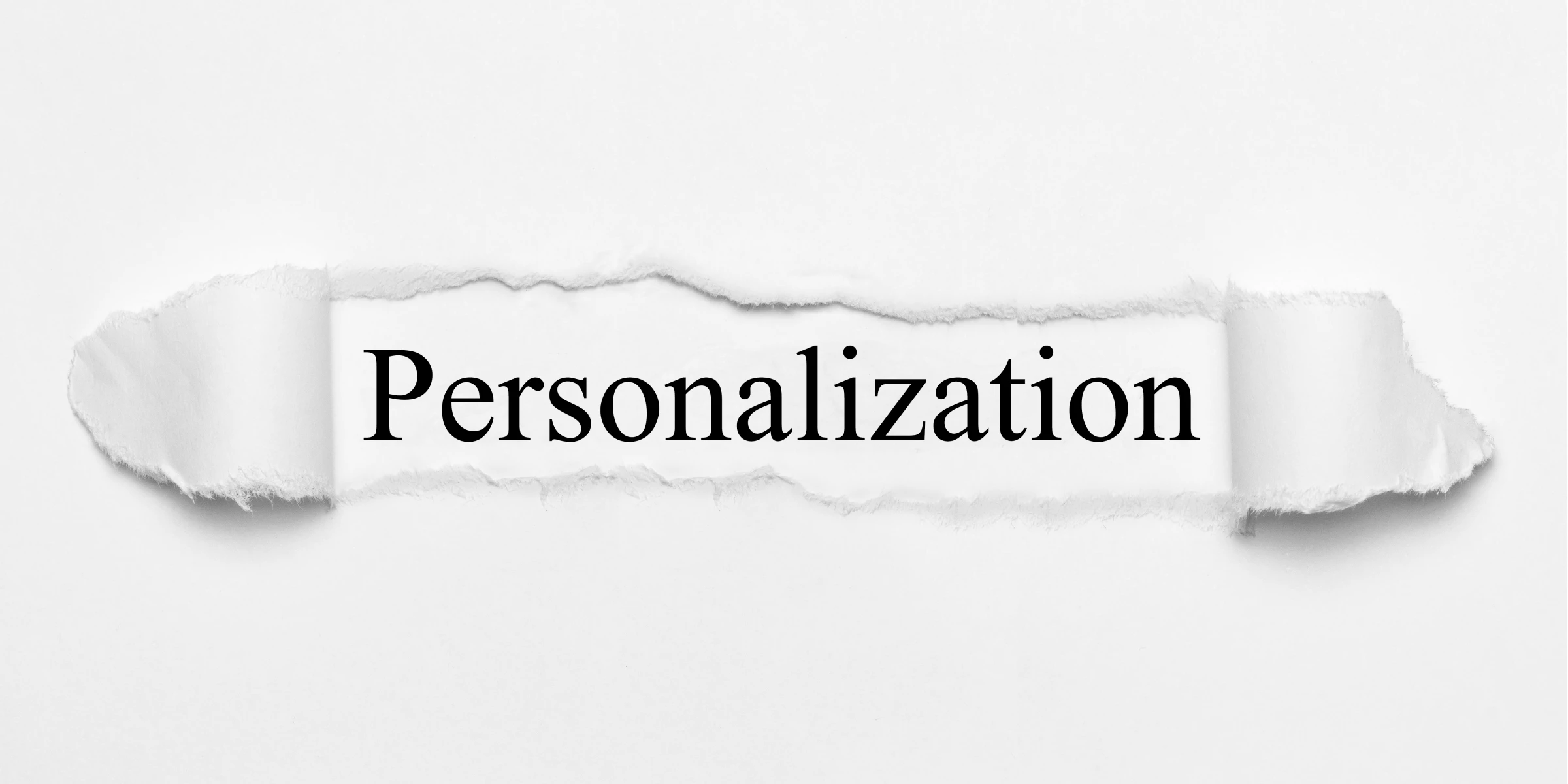 “Personalization” written on white, torn paper