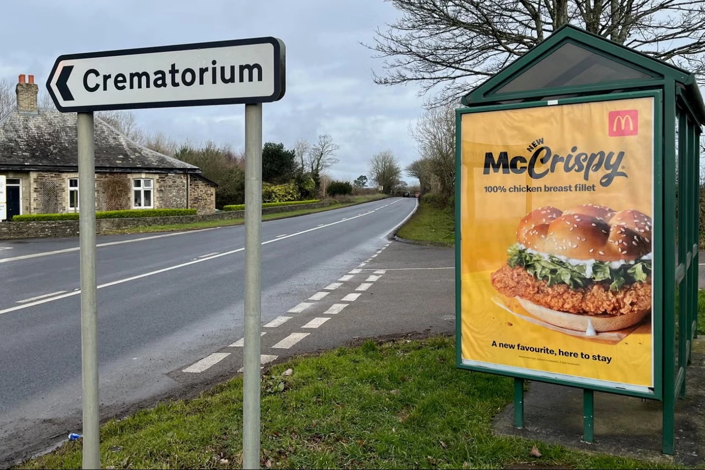 McDonald's McCrispy ad placed next to a crematorium road sign