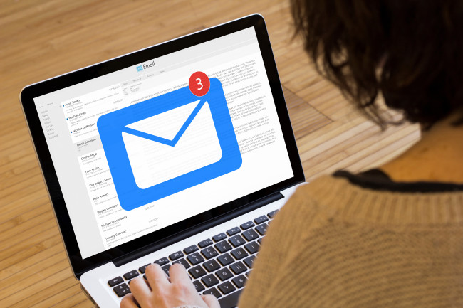 A woman opens her email 