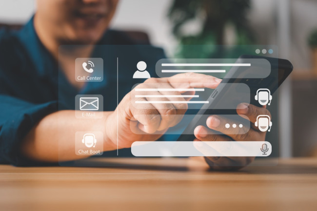 A customer talks to a chatbot on a smartphone 