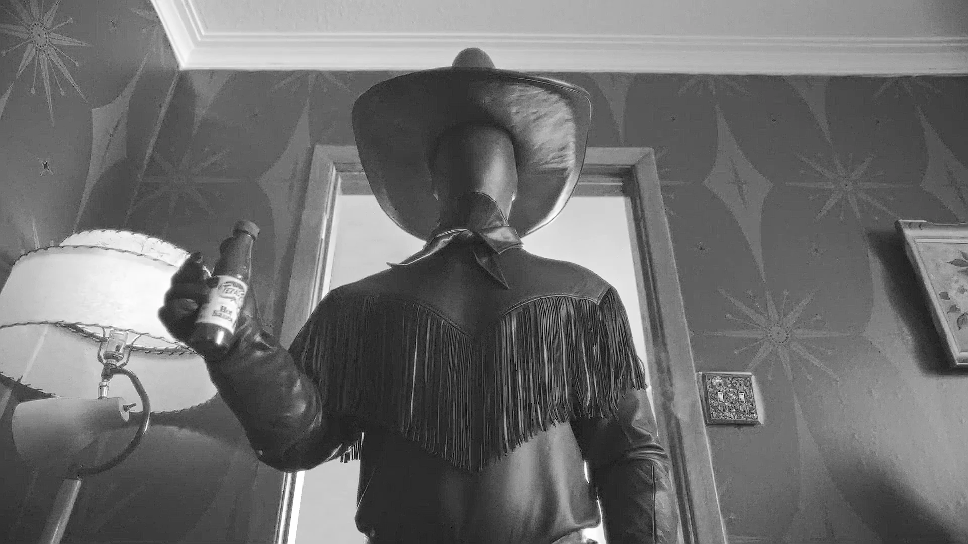 Texas Pete holds a bottle of hot sauce