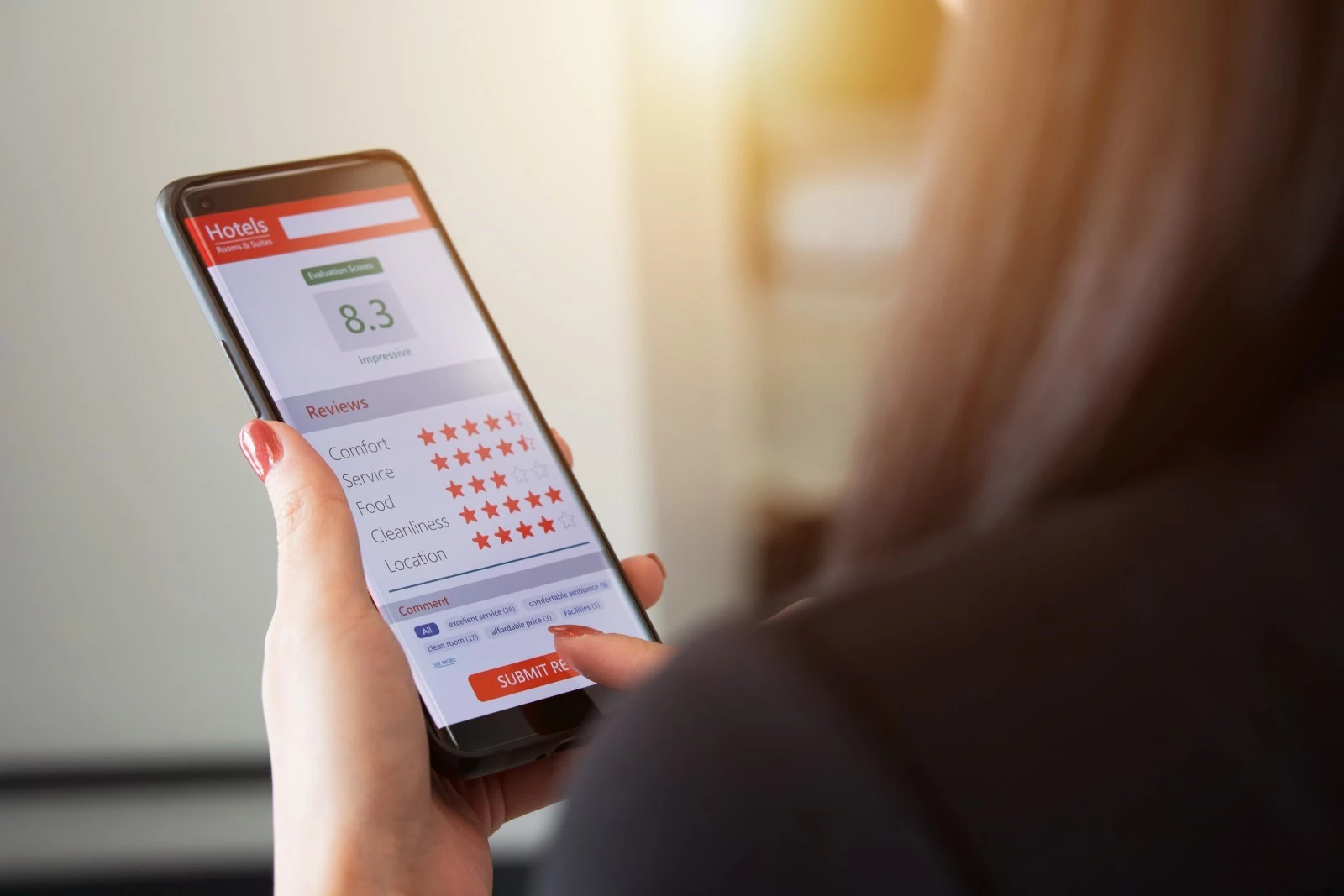 A customer rates a company’s customer service on her phone
