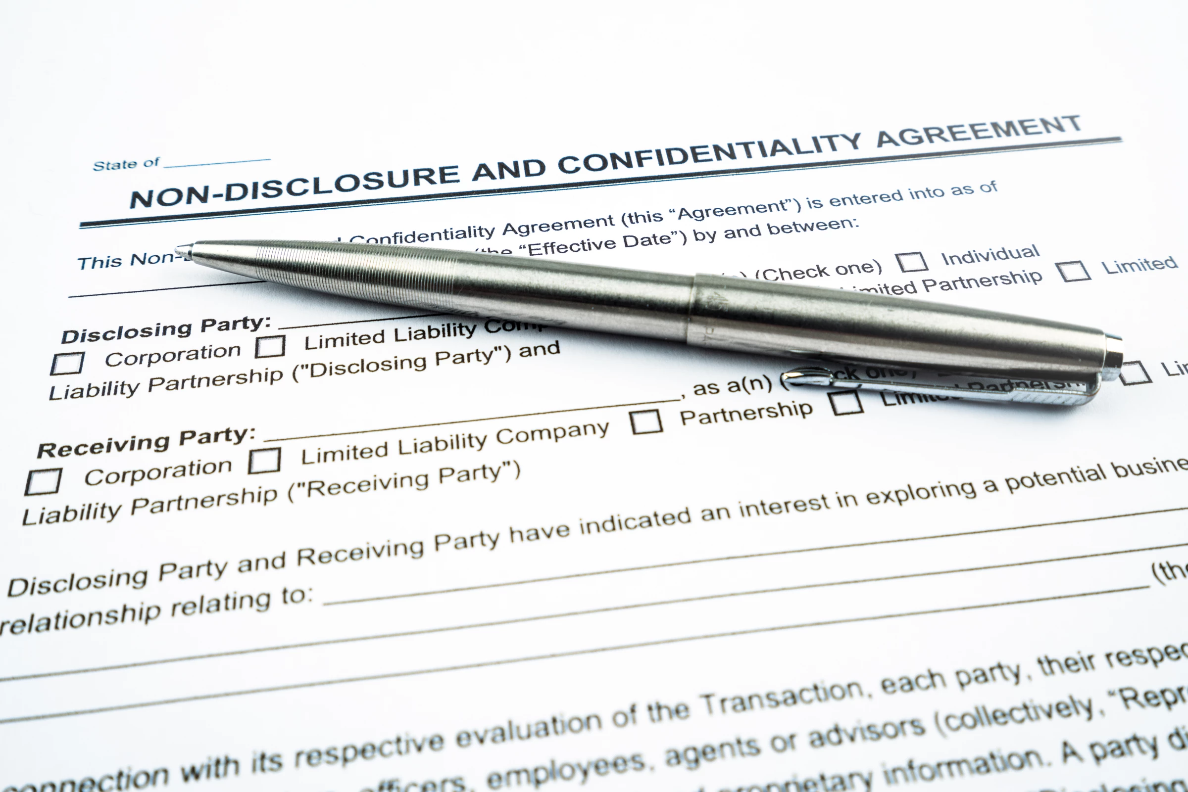 A pen on top of a nondisclosure agreement