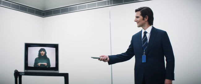 "Severance" star Adam Scott shows a video