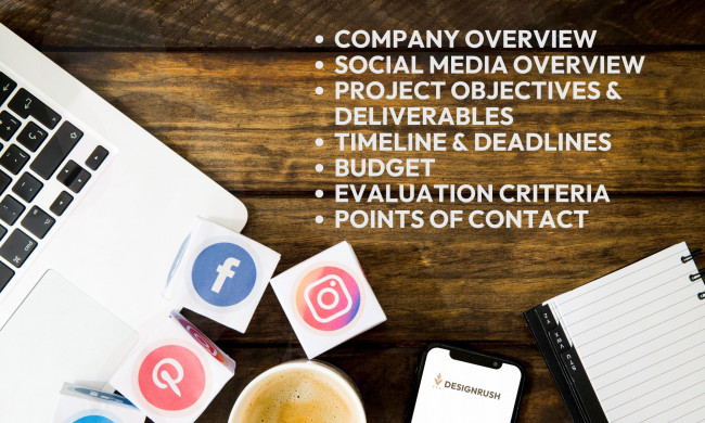 A laptop, social media icons, and a notebook on a wooden table