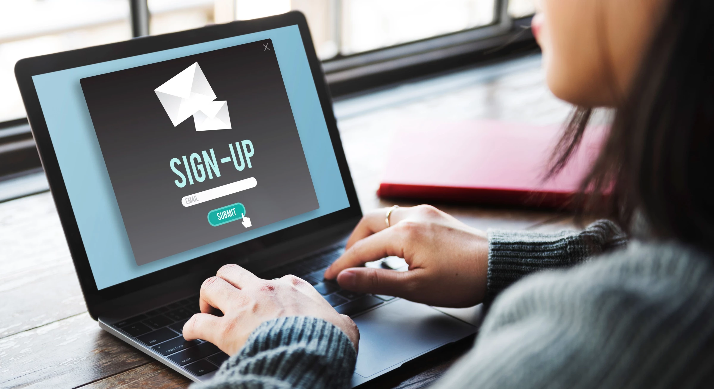 A woman signs up for a newsletter