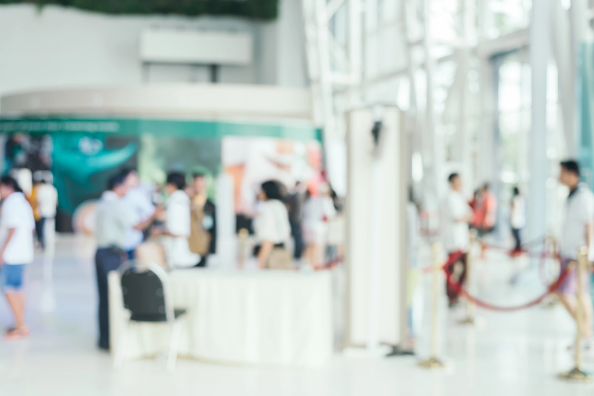 A blurred image of people at a networking event