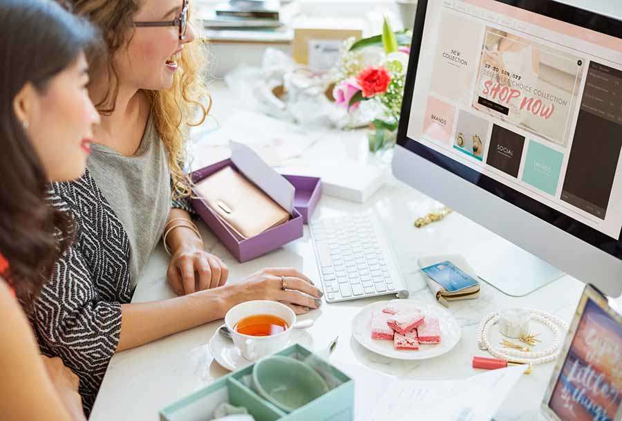 Two women selling goods online