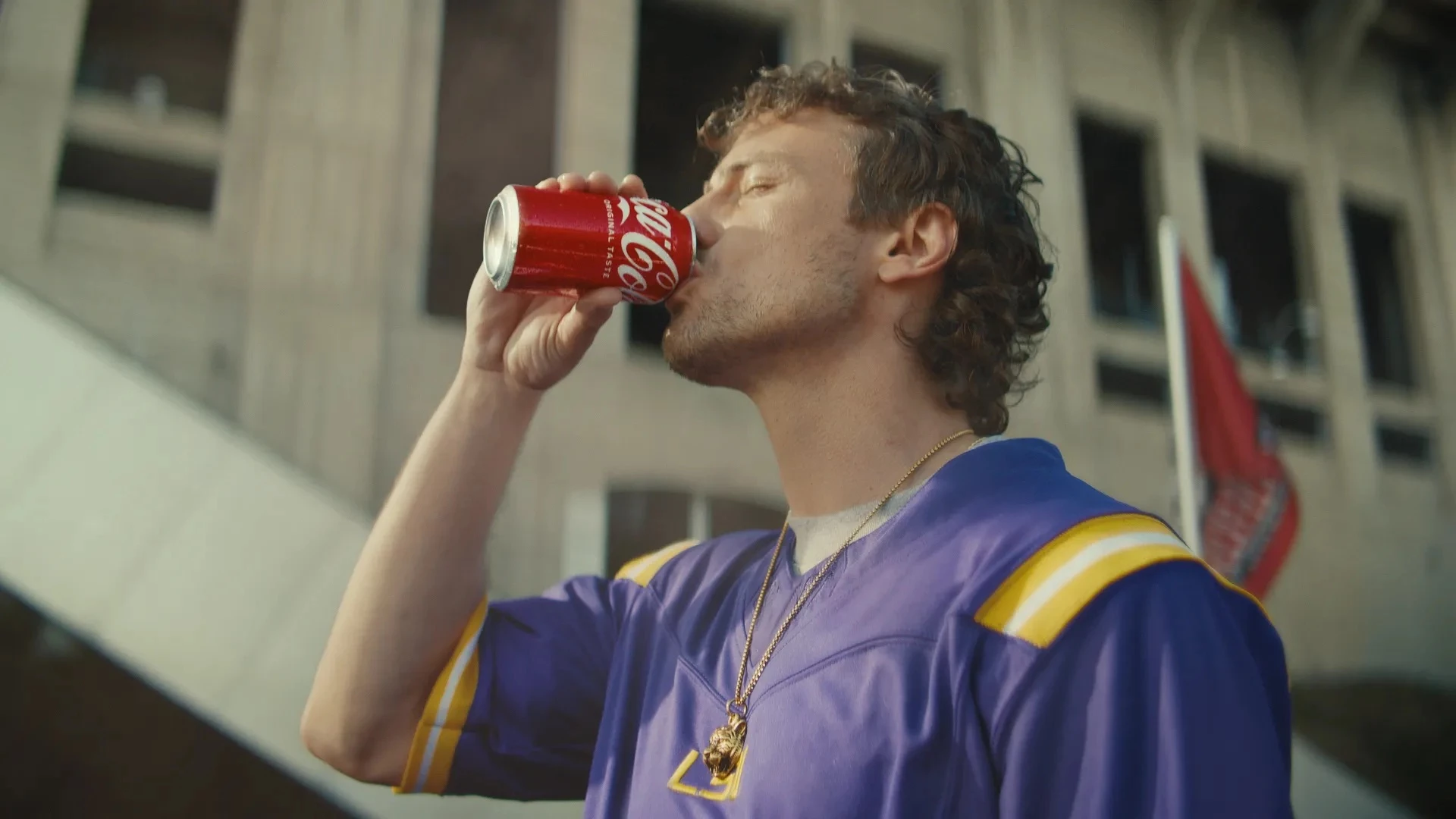 A Sports Fan Enjoys a Can of Coca-Cola | Source: Coca-Cola