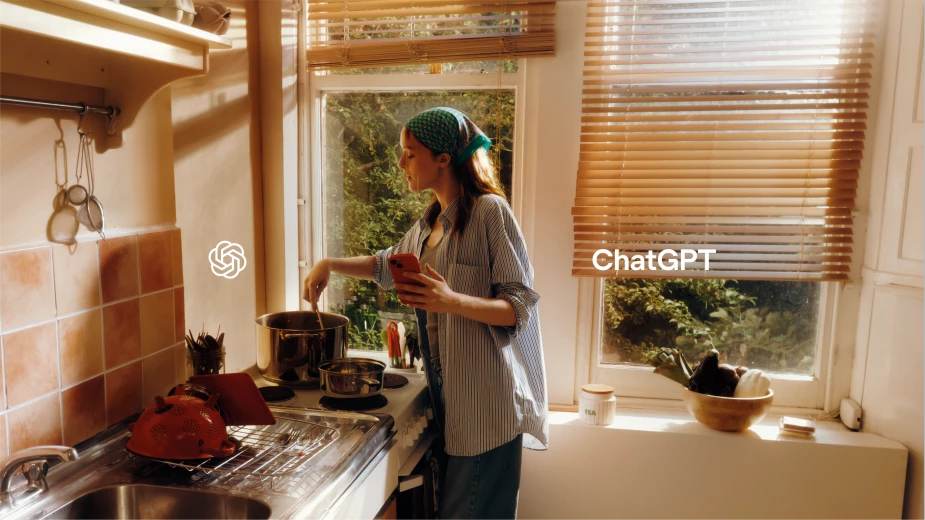 A woman on her phone cooks with the help of ChatGPT | Source: OpenAI