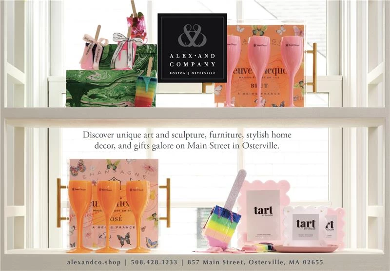 Alex & Company Retail Brand Launch Display Window display for Alex & Company featuring colorful luxury home decor, Veuve Clicquot gift sets, and Tart by Taylor products, highlighting the brand’s upscale retail identity in Osterville.